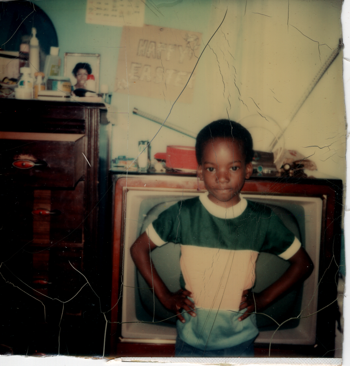 Melvin in front of a TV. He's about 6. Likely mid 70s.