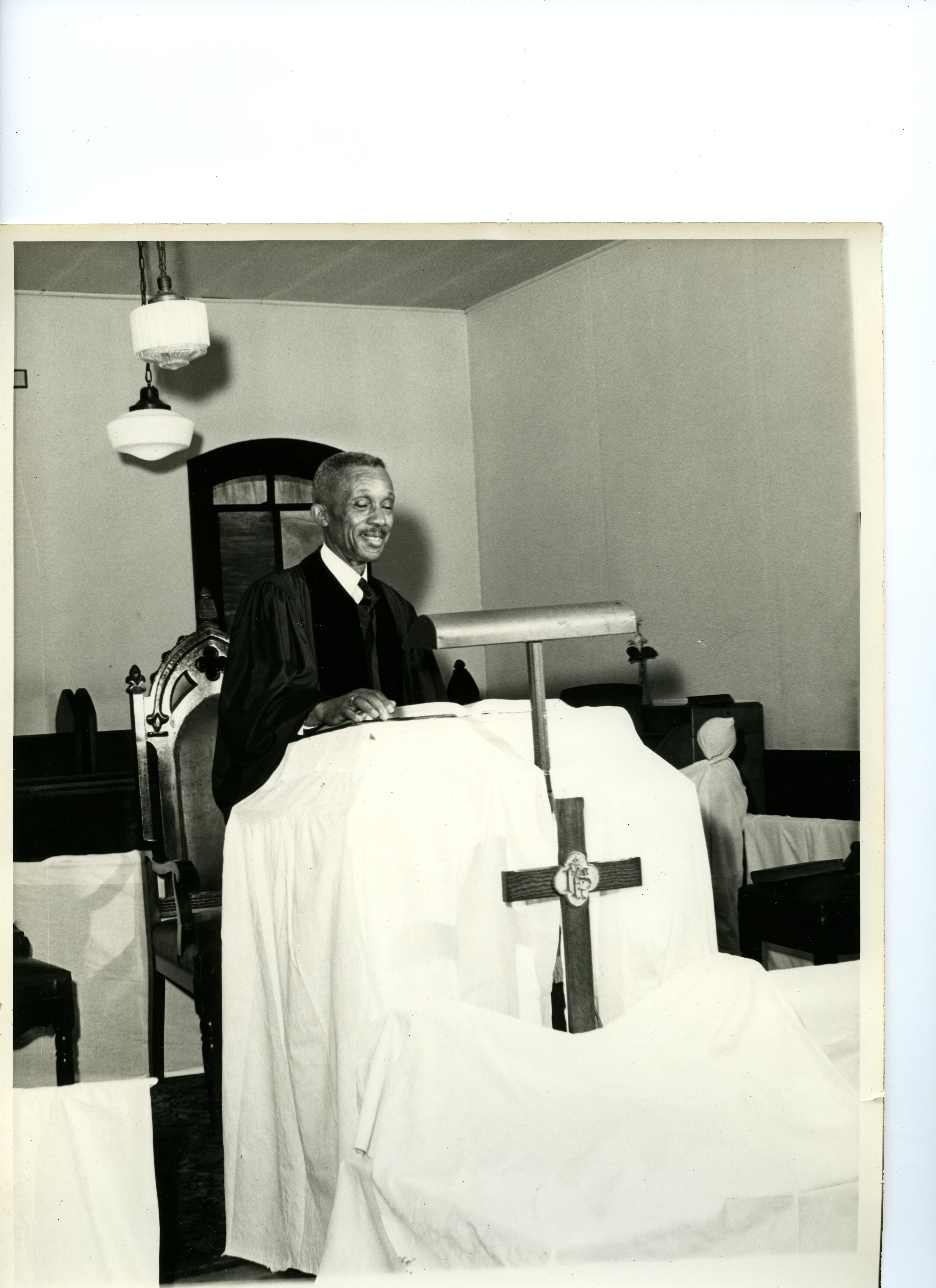 Rev. Robert H. Baddey pastor of Embry AME Church in pulpit 