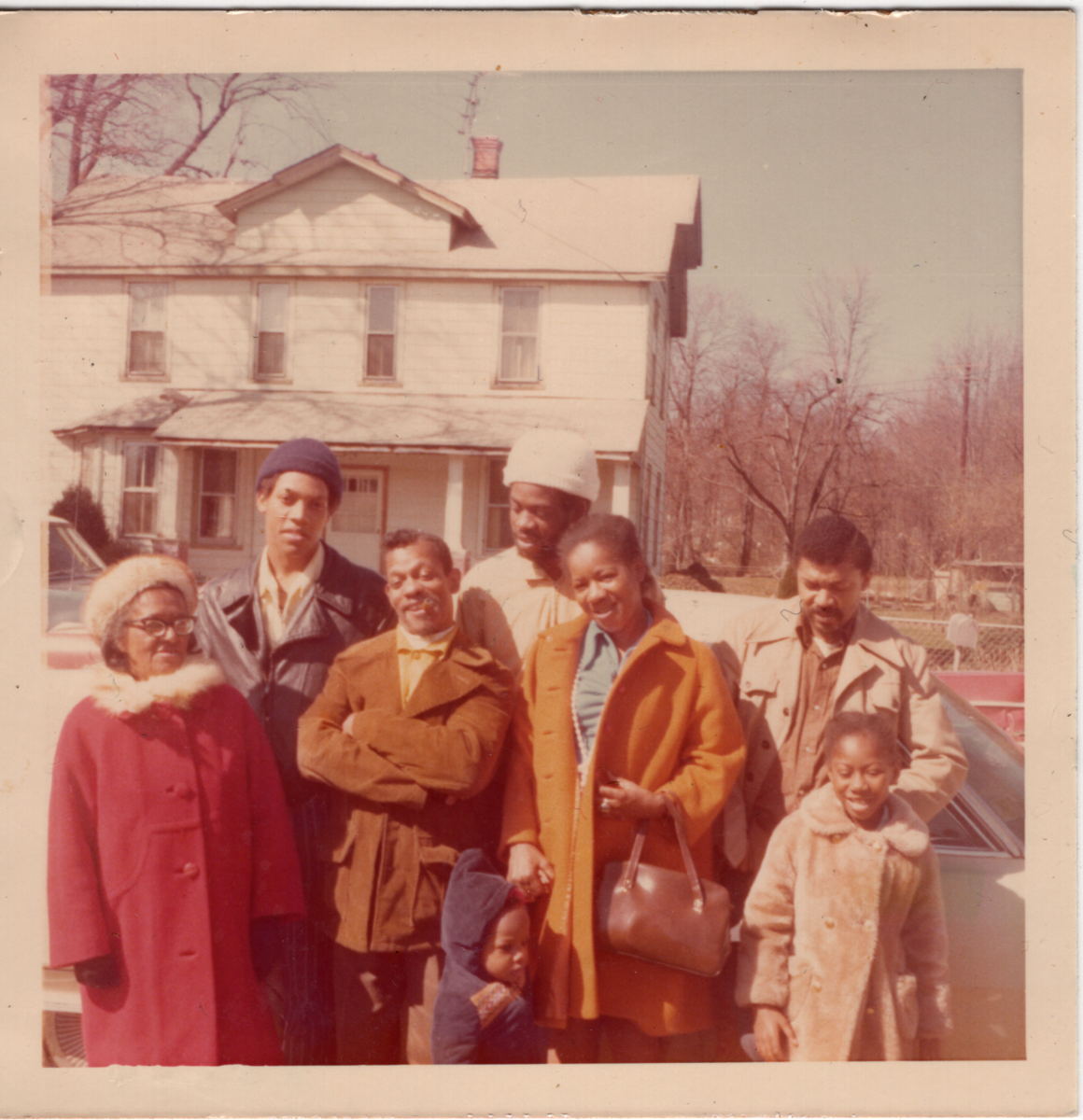 Family photo in front of the Sellers in Lakeland on Navahoe Street, across from where donor lived, in mid 70's. Pictured are Donor's mother, Carry, Moses, Boy, Osceola Sr. and Jr., and unknown on the far right. 