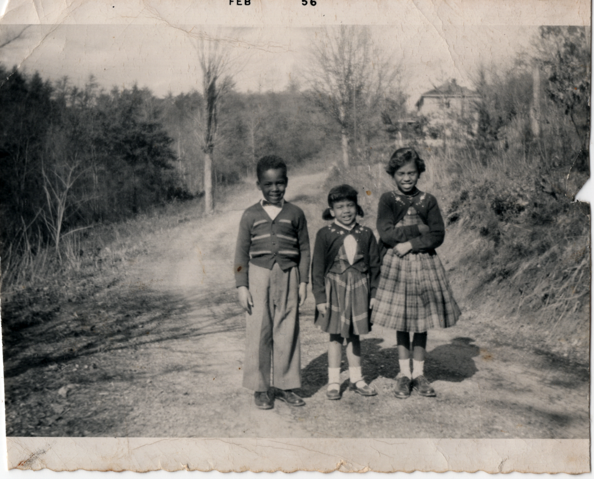 February '56. Three kids standing in a road. Donor's Essex cousins, from Virginia. His "mother's people." 