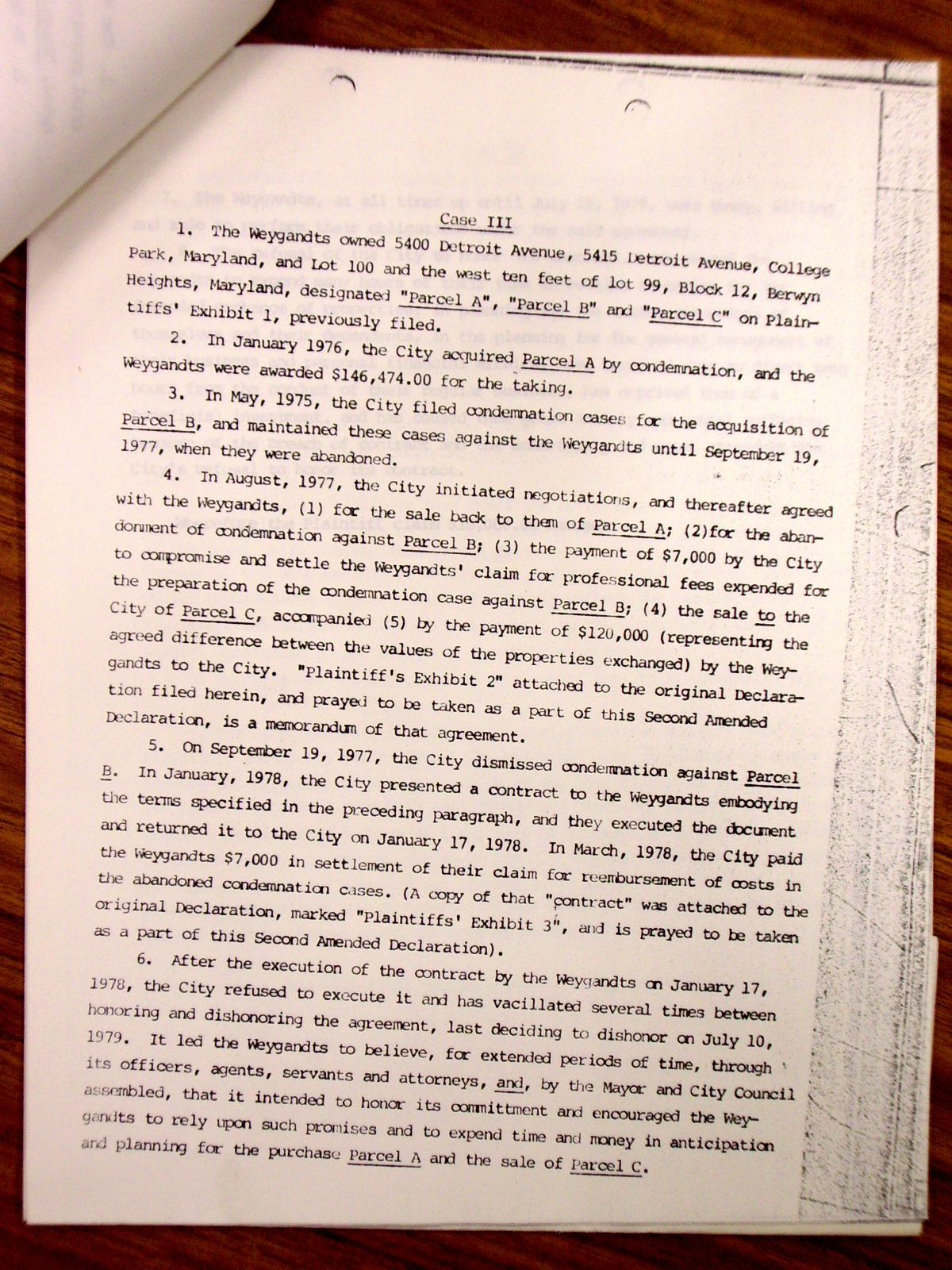 Memorandum from Jack Callahan to Leon Shore, enclosing a letter from Mr. Morris Topf giving the status of the Weygandt suit