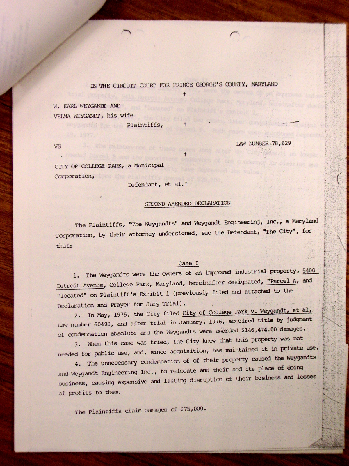 Memorandum from Jack Callahan to Leon Shore, enclosing a letter from Mr. Morris Topf giving the status of the Weygandt suit