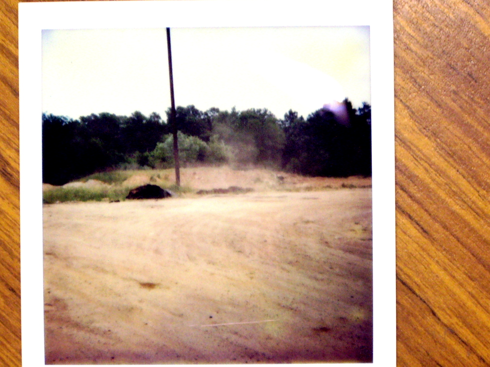 Image of vacant lot with dirt road