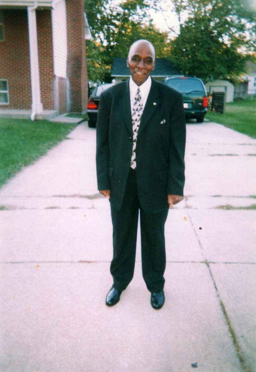 Photo from Donor Paulette McNair's Aunt Rosa's funeral. Harold Adams in a suit. 