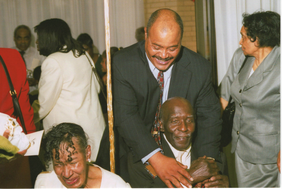 Donor Jennifer Campbell-Dawkins' mother and father celebrating their 50th wedding anniversary, with cousin Isaiah Johnson, in early 2000s, at a restaurant in PG County.