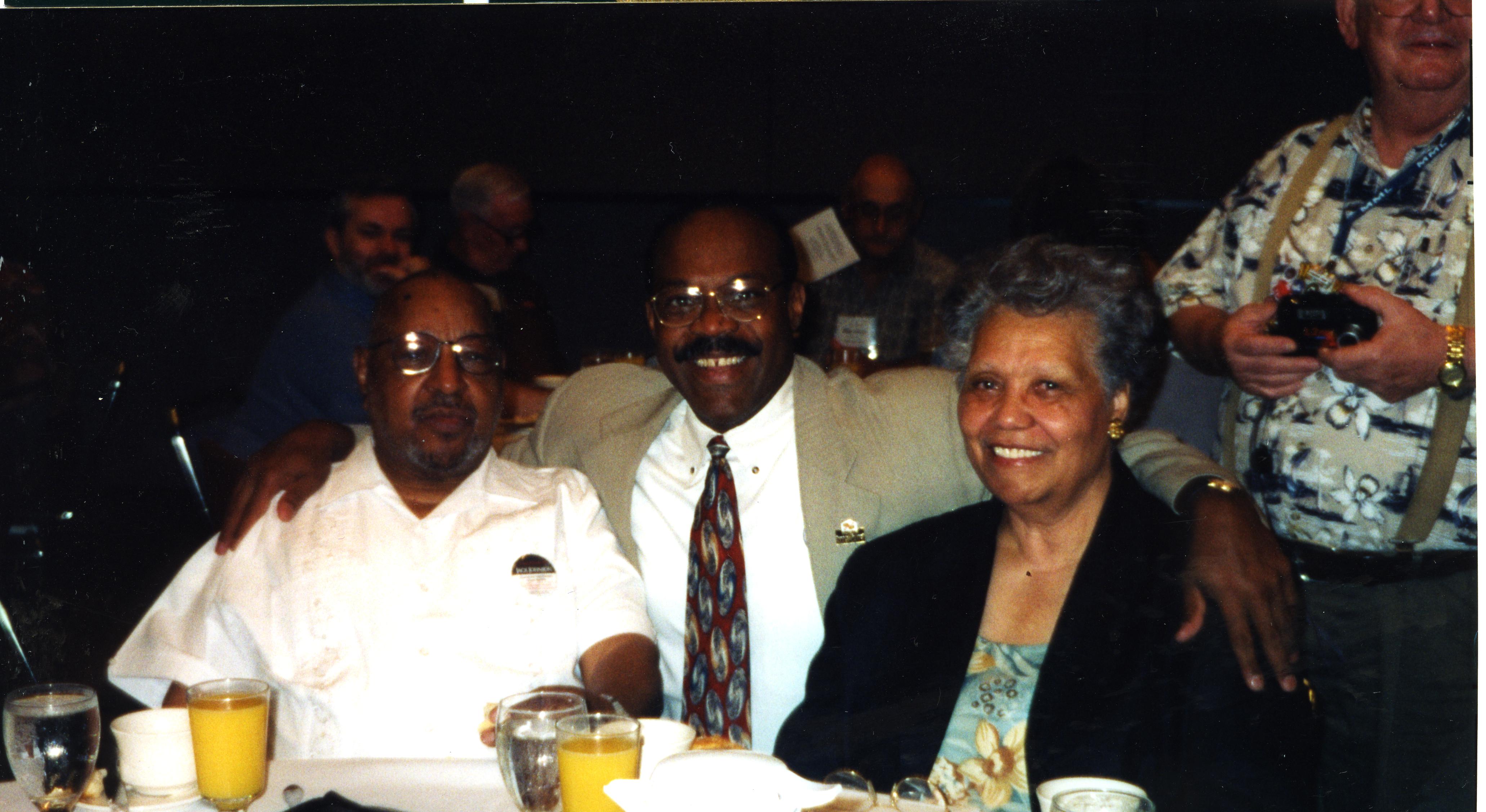 Mr. and Mrs. Lomax at event with Wayne Curry